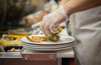 Chef Plating Gourmet Food in Professional Kitchen
