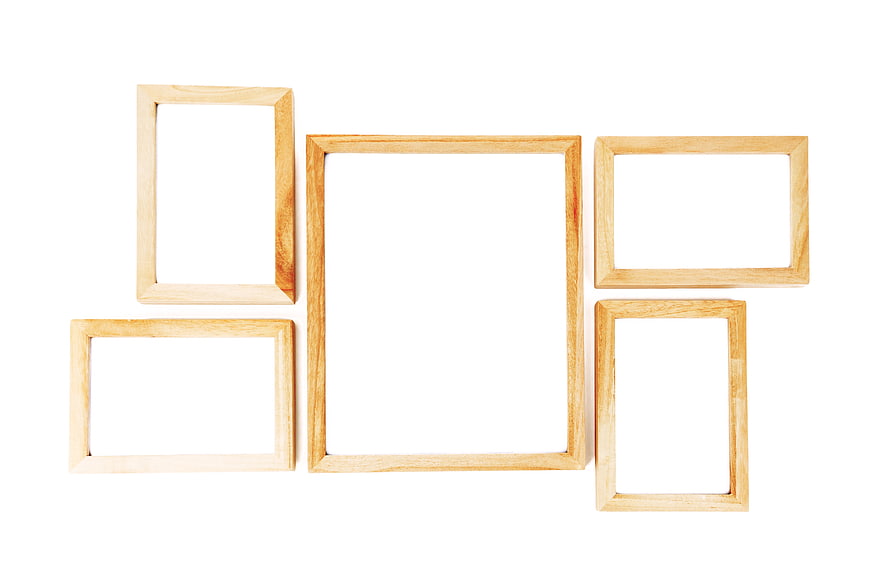 Five Empty Wooden Photo Frames Arranged On White Background