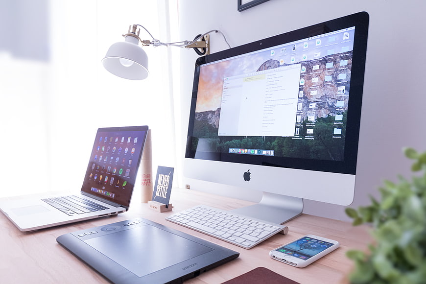 Modern Home Office Workspace with Apple Computer and Laptop