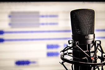 Professional Studio Microphone with Blurred Audio Software Background
