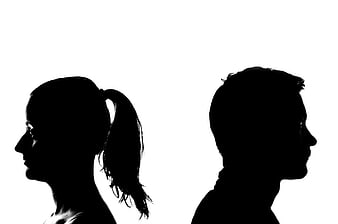 Silhouette of couple facing away from each other
