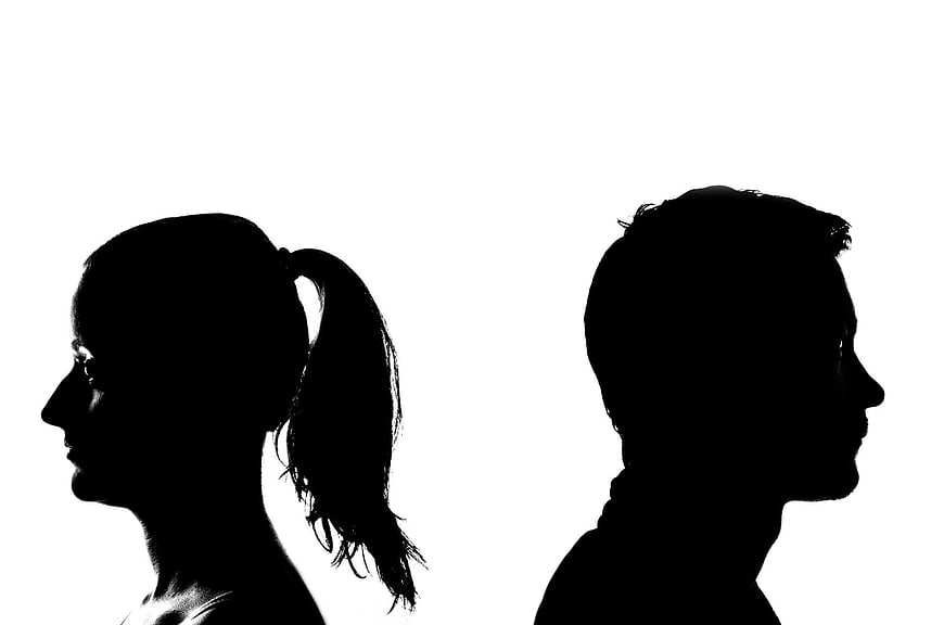 Silhouette of couple facing away from each other