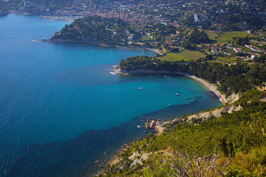 Aerial View of Turquoise Mediterranean Coastline with Beach and Town