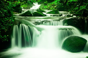 Mossy Forest Waterfall With Smooth Long Exposure Water Flow