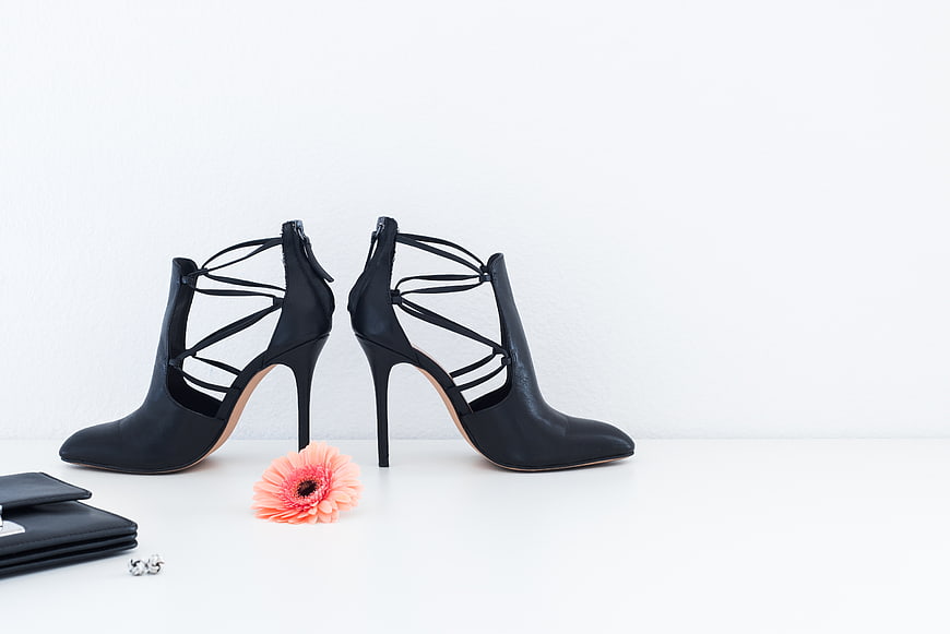 Black strappy high heel ankle boots with flower and accessories