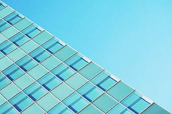 Modern Glass Building Facade Against Blue Sky