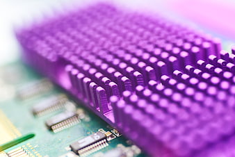 Macro shot of purple computer heat sink on circuit board