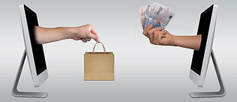 Online Shopping Concept With Computer Monitors, Hands, Euro Banknotes, And Paper Bag