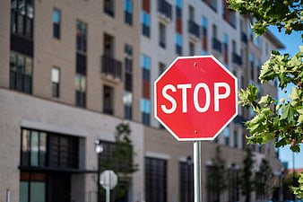 Red Stop Sign in Urban City Street