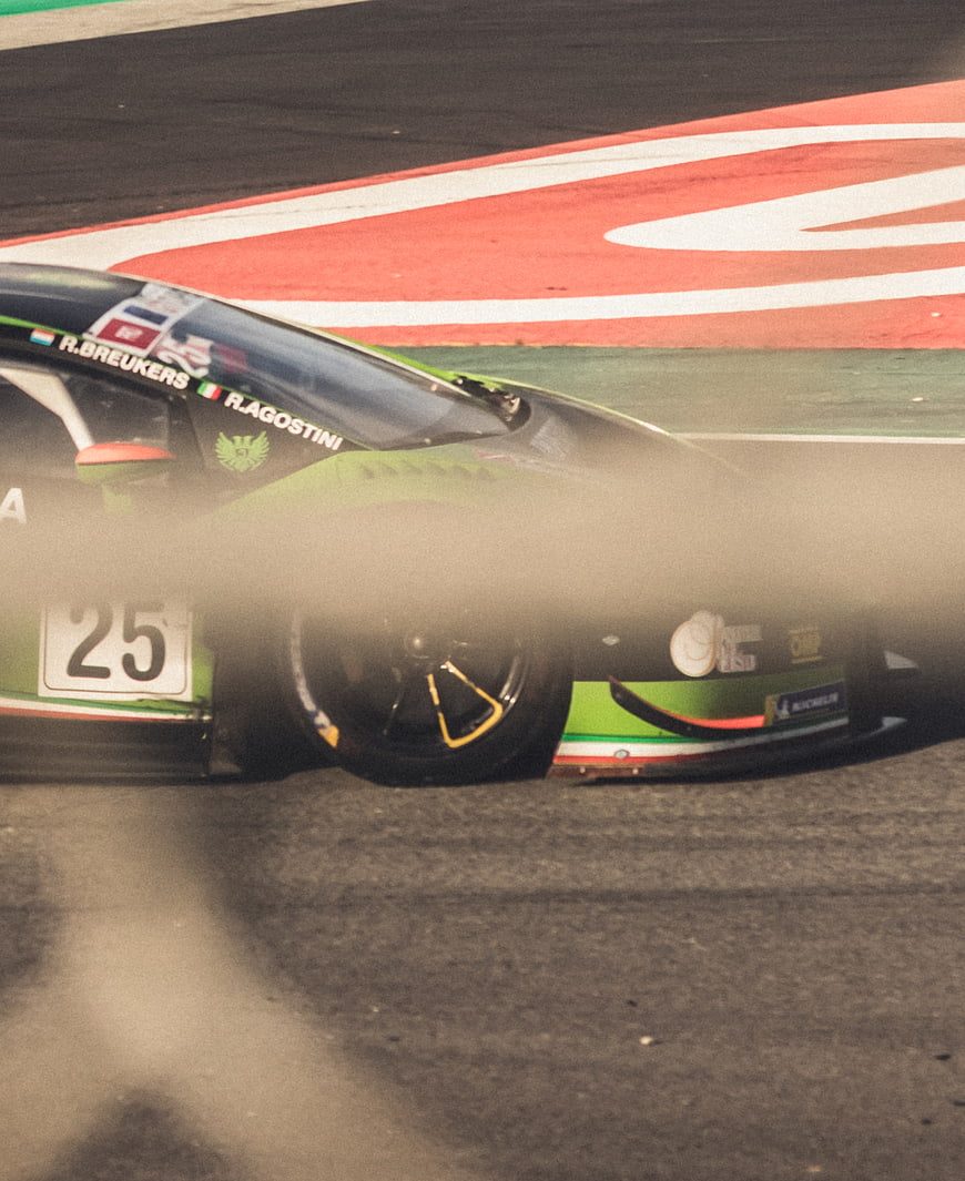 Green Racing Car Number 25 on Track