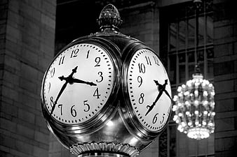 Vintage Black and White Clock with Chandelier Background