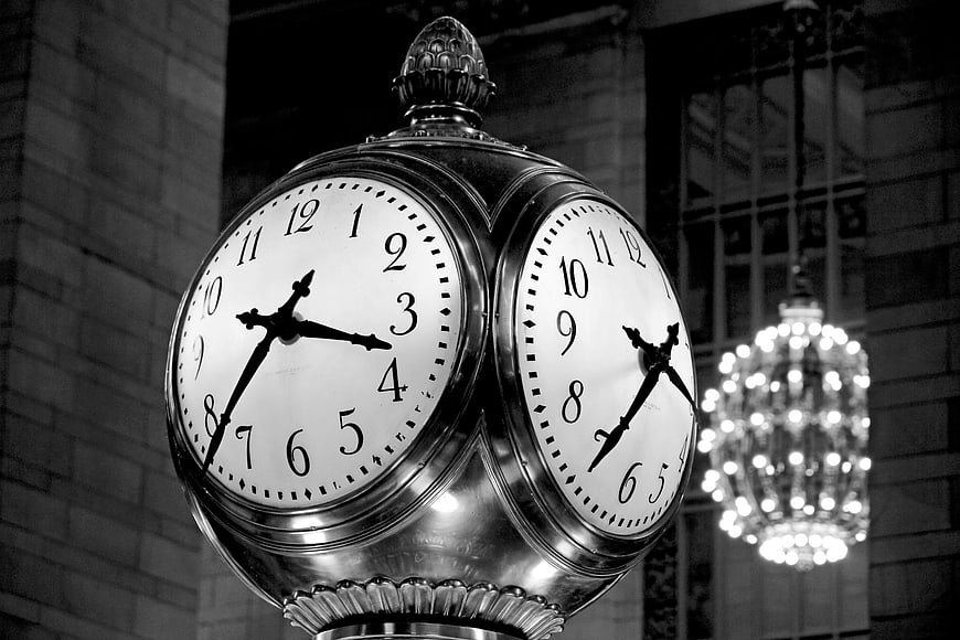 Vintage Black and White Clock with Chandelier Background