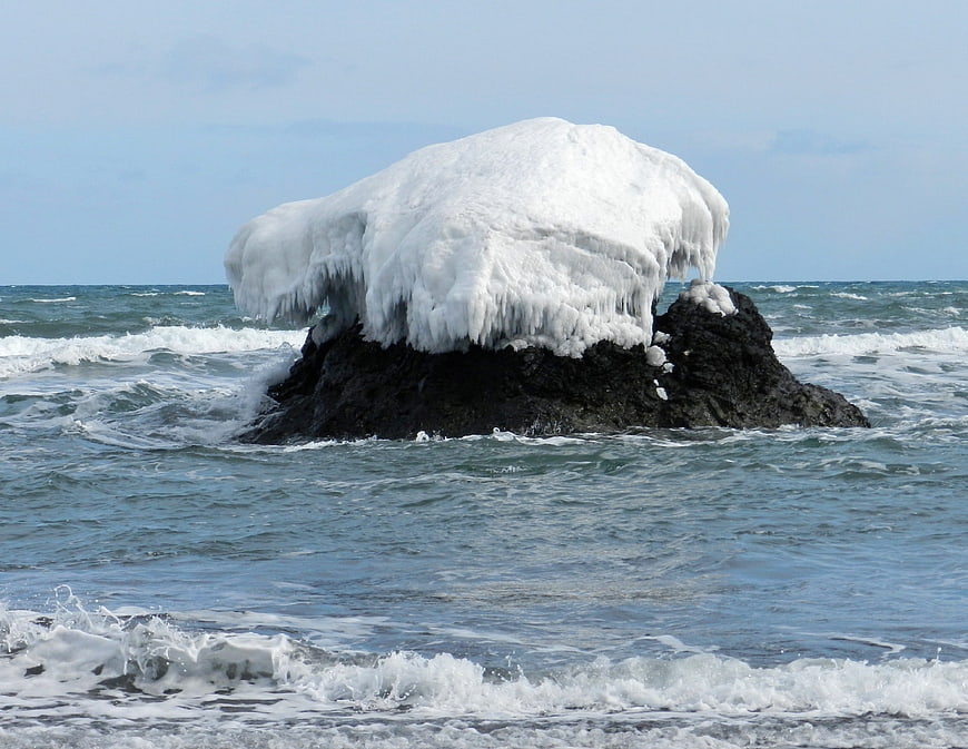 Frozen rock formation in the Pacific Ocean during winter