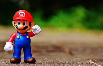 Super Mario Figure Toy on Outdoor Path