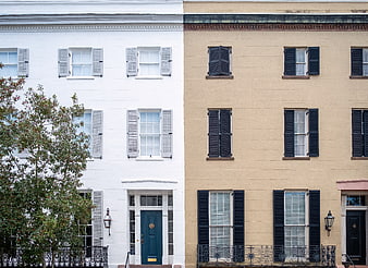 Colorful historic townhouses with shutters and classic architecture