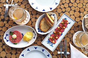 Top view of steak tartare and beef carpaccio with beer