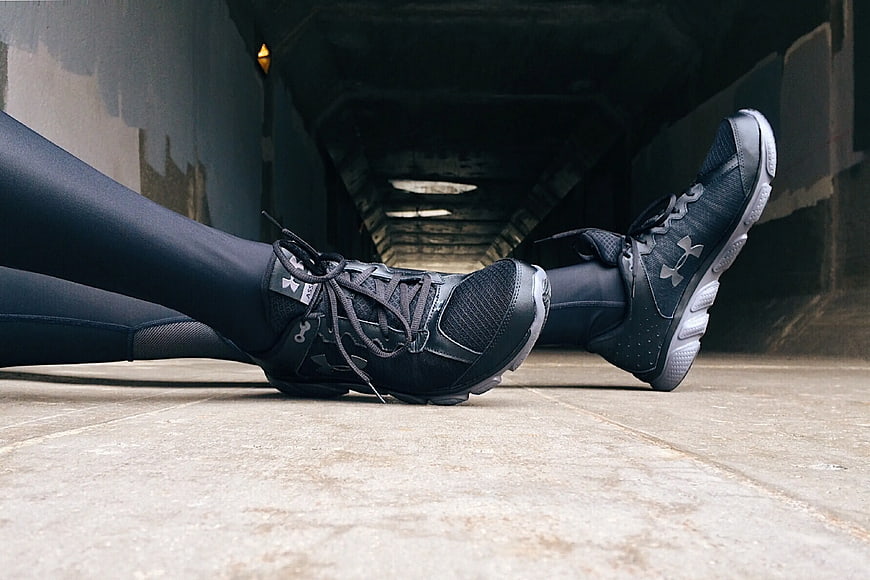 Black Under Armour Running Shoes on Concrete