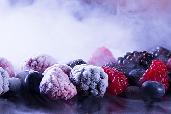 Frozen mixed berries with frost and smoke effect