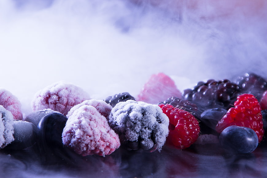 Frozen mixed berries with frost and smoke effect
