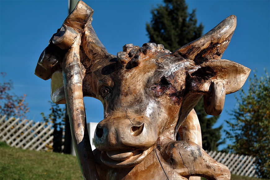 Handcrafted Wooden Cow Sculpture with Axe