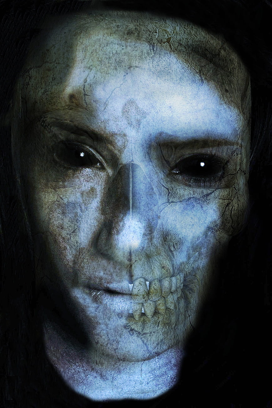 Horror photomontage of a zombie face with skull overlay