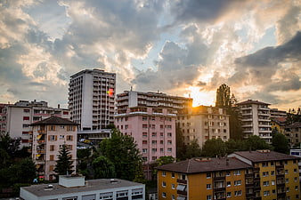 Urban Residential Cityscape at Sunset with Dramatic Clouds