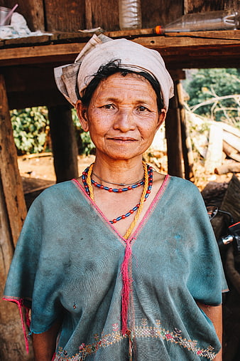 Portrait of an elderly Karen woman in traditional attire
