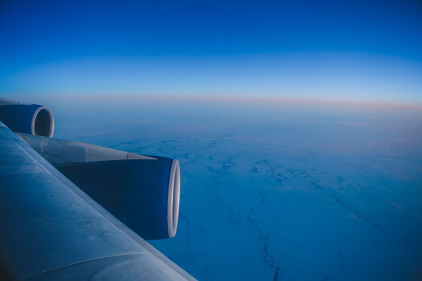 Aerial View of Frozen Arctic Ocean from Airplane Window
