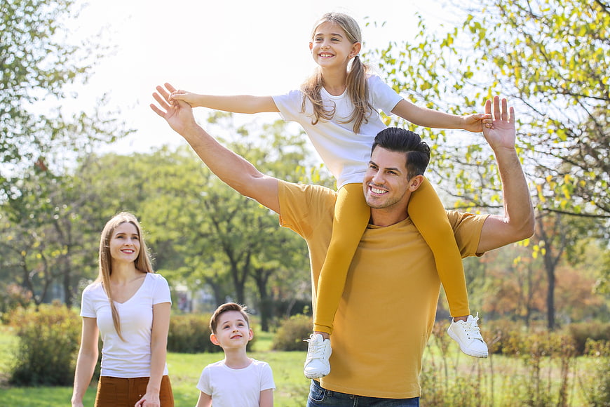 Happy Family Playing Together in a Sunny Park