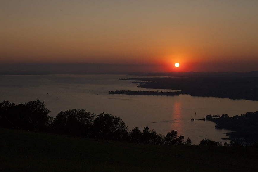 Serene Sunset Over Lake Constance with Silhouetted Islands