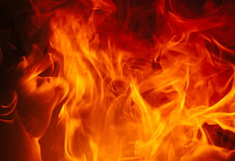 Close-up of intense orange and red flames burning