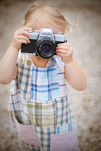 Little Girl Holding Vintage Minolta Film Camera