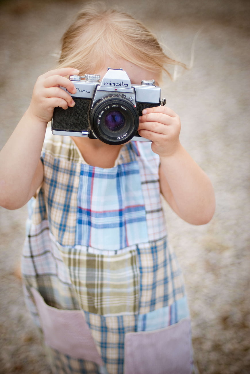 Little Girl Holding Vintage Minolta Film Camera