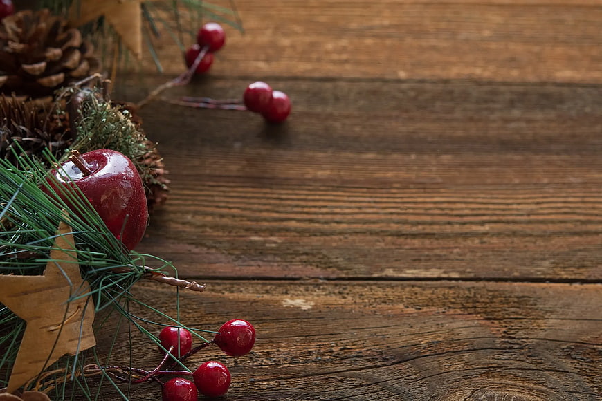 Christmas Apple and Berries on Rustic Wood Background