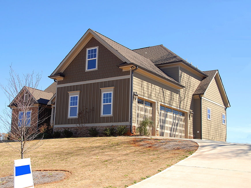 Modern Brown and Beige House with Blue Sky
