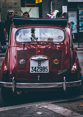 Rear view of vintage red SEAT 600 D car