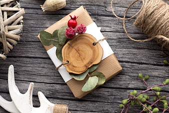 Rustic Christmas Gift Wrapped in Kraft Paper with Wood Slice