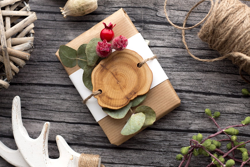 Rustic Christmas Gift Wrapped in Kraft Paper with Wood Slice