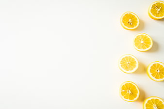 Fresh Lemon Slices on White Background with Copyspace