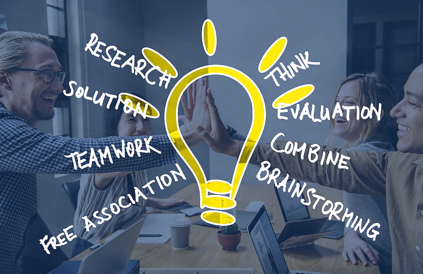 Team Brainstorming Concept With Lightbulb Graphic And Keywords