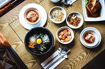 Overhead View of Korean Bibimbap and Side Dishes