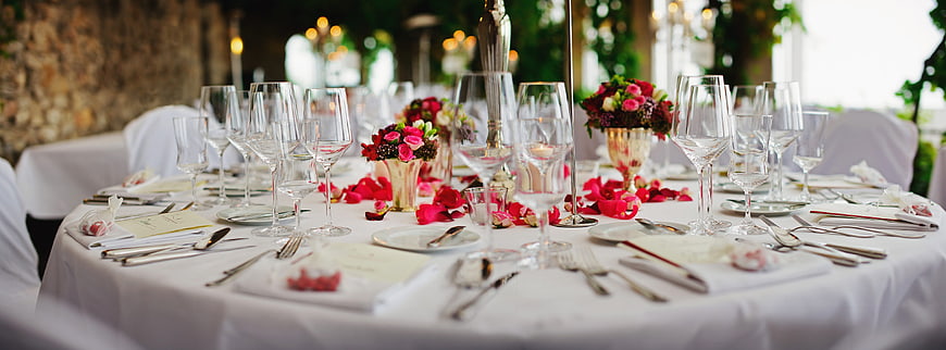 Elegant Wedding Reception Table Setting with Pink Flowers