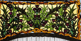 Stained glass window with thistle floral design