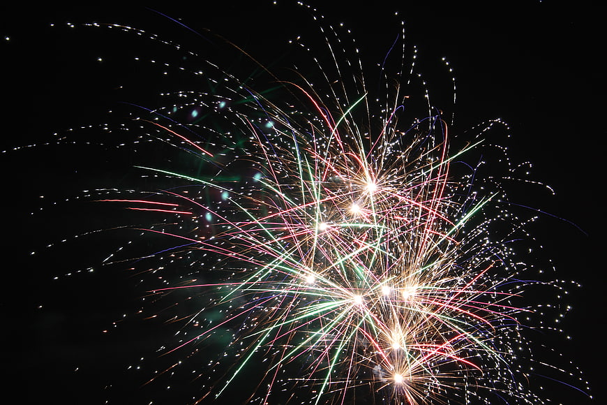 Colorful Fireworks Bursting in Night Sky