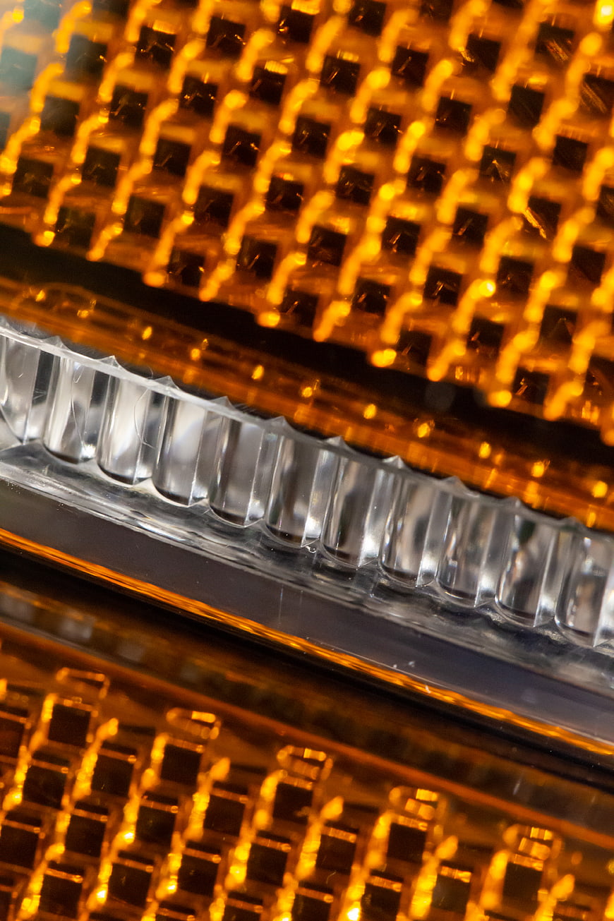 Close-up of glowing amber automotive turn signal light