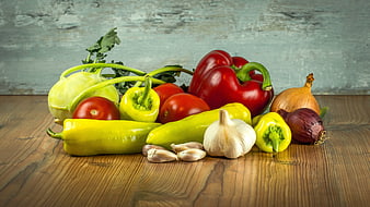 Assorted Fresh Vegetables Including Tomatoes, Peppers, Garlic, Onions, and Kohlrabi