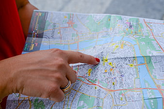 Woman pointing at location on city map