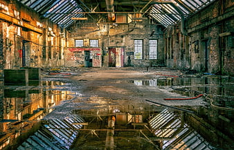 Abandoned Industrial Factory Hall With Water Reflections And Graffiti