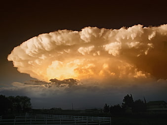 Dramatic Supercell Storm Cloud Over Rural Landscape