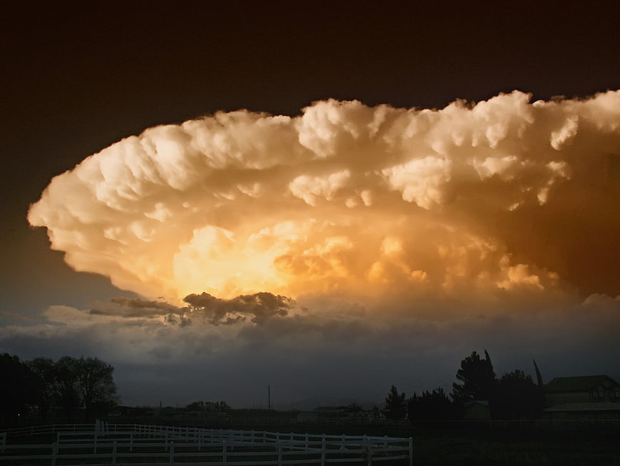 Dramatic Supercell Storm Cloud Over Rural Landscape